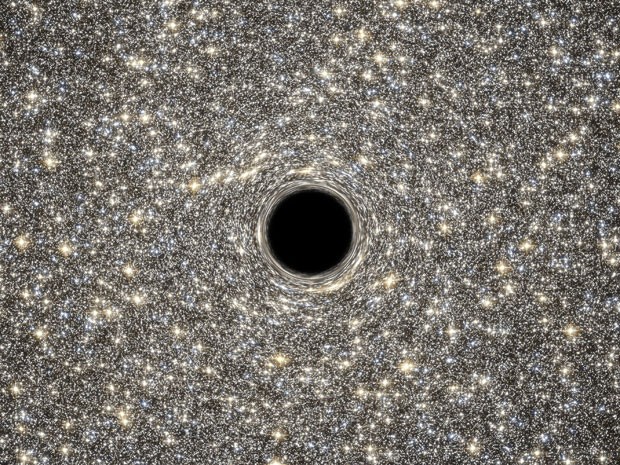 Ilustração mostra o buraco negro supermaciço dentro de galáxia anã  (Foto: Nasa/ESA/AFP)