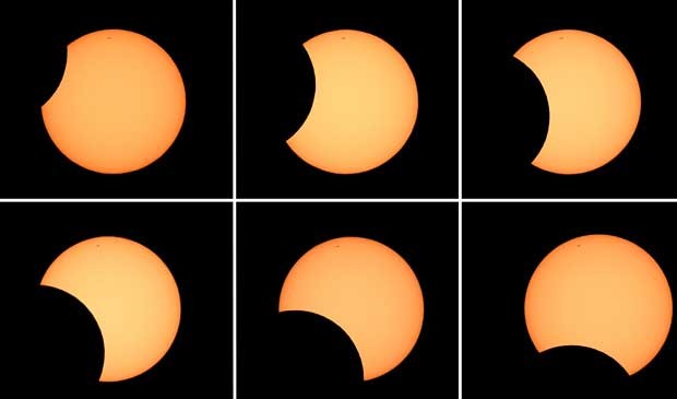 Combinação de seis fotos mostra a lua cruzando a frente do sol. (Foto: AFP Photo)