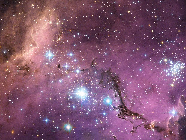 Hubble observou nuvens de poeira que se chocam e formam estrelas na Grande Nuvem de Magalhães (Foto: ESA/NASA/Hubble)
